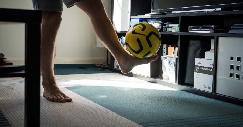 practising football skills indoors