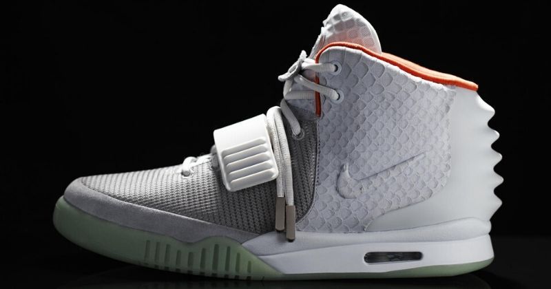 collection of Nike Air Yeezy 2 in white on black background
