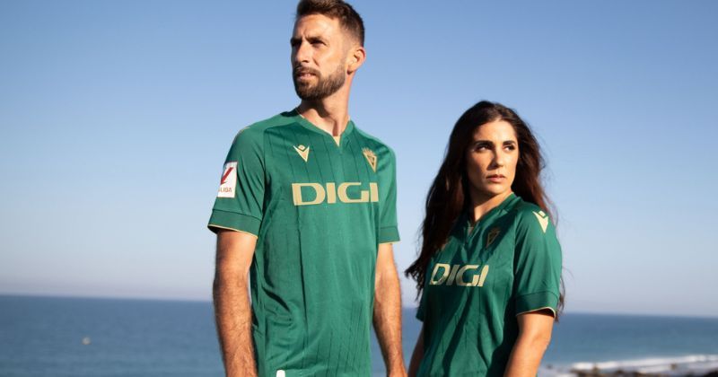 male and female wearing cadiz 2023-24 third shirt in green