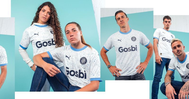female and male players wearing girona 2023-24 away shirt in white and light blue