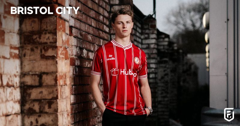 model in street wearing bristol city 2023-24 home shirt in red