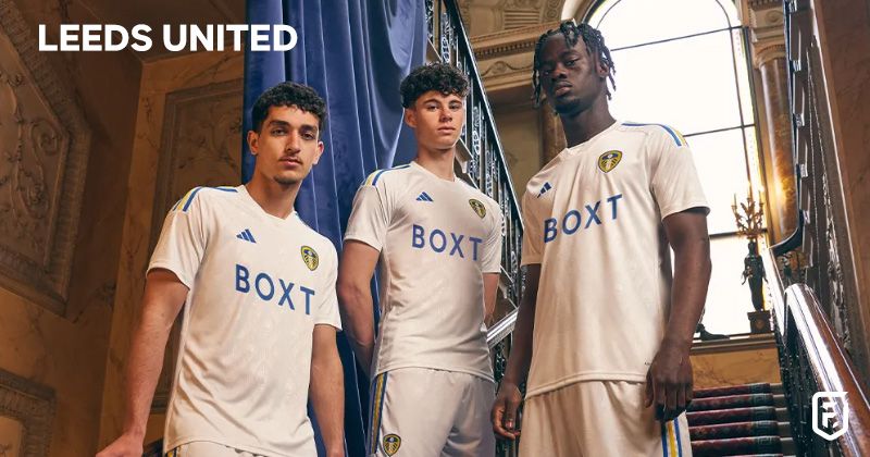 players stood on stairs wearing leeds united 2023-24 home shirt in white