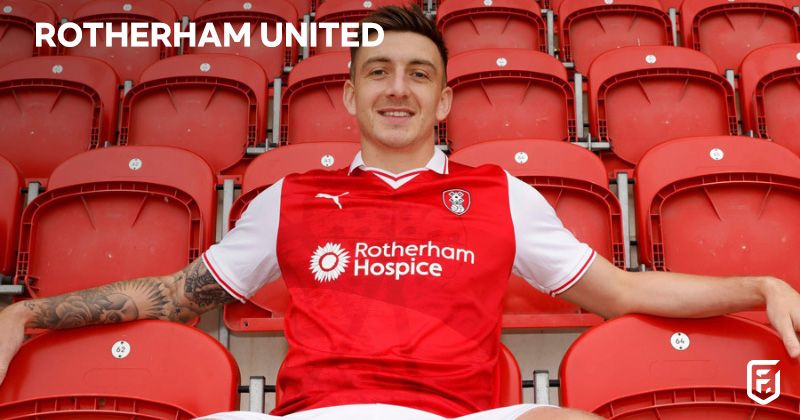 player wearing rotherham united 2023-24 home shirt in red and white