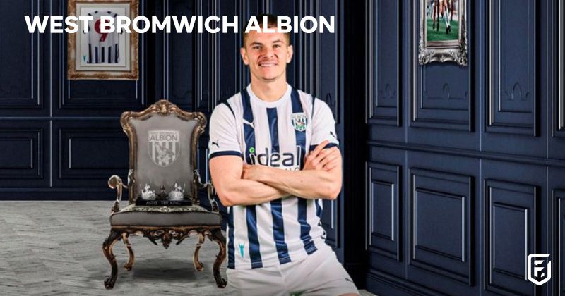 player wearing west brom 2023-24 home shirt in blue and white